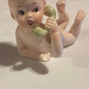 Charming Ceramic Baby Figurine with Green Phone